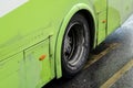 Neglected technical care of Maltese buses shown at rusty bodywork of an old green bus with dirty tyre and wheel