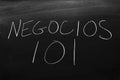 Negocios 101 On A Blackboard. Translation: Business 101