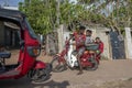 A father and son transporting a basket of dried fish at Negombo in Sri Lanka.