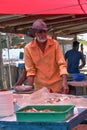 Old man selling fish at Negombo fish market.