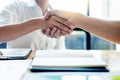 Negotiating business, Two confident business man shaking hands with partners together after finishing up a meeting succeeded Royalty Free Stock Photo