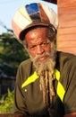 NEGRIL, JAMAICA - MAY 24. 2010: Portrait of rasta man with beard, dredlocks and rastacap