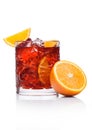 Negroni Cocktail in crystal glass with ice cubes and orange slices on white background with reflection Royalty Free Stock Photo