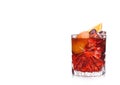 Negroni Cocktail in crystal glass with ice cubes and orange slices on white background with reflection Royalty Free Stock Photo