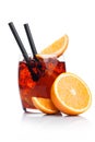 Negroni Cocktail in luxury glass with ice cubes and orange slices with straw and half of fresh orange on white background with Royalty Free Stock Photo