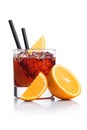 Negroni Cocktail in modern glass with ice cubes and orange slices with straw and half of fresh orange on white background with Royalty Free Stock Photo