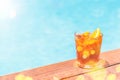 Negroni cocktail near a pool at the resort bar or suite patio. Luxury resort, vacation, room service concept Royalty Free Stock Photo