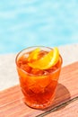 Negroni cocktail near a pool at the resort bar or suite patio. Luxury resort, vacation, room service concept Royalty Free Stock Photo