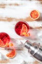 Negroni cocktails with blood oranges and a shaker, top shot