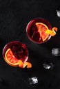 Negroni cocktails with orange rind, shot from the top with ice cubes Royalty Free Stock Photo