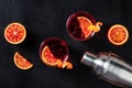 Negroni cocktails, overhead flat lay shot with blood oranges and a shaker Royalty Free Stock Photo