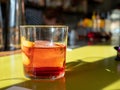 Negroni drink sitting on green bar counter top Royalty Free Stock Photo