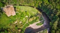 Neidpath Castle on a river bank - aerial view