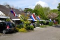 Neighborhood in a dutch village with the dutch flag on kingsday Royalty Free Stock Photo