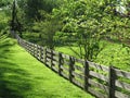 Neighborhood Fence During Spring in April Royalty Free Stock Photo