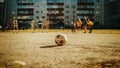 Neighborhood Kids Playing Soccer Outside in Urban Backyard. Young Football Player Making a Penalty Royalty Free Stock Photo