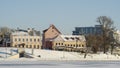 Neighborhood of old houses and modern buildings in winter. Retro versus modern style. Contrast in architecture. Royalty Free Stock Photo