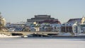 Neighborhood of old houses and modern buildings in winter. Retro versus modern style. Contrast in architecture. Royalty Free Stock Photo