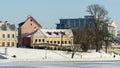 Neighborhood of old houses and modern buildings in winter. Retro versus modern style. Contrast in architecture. Royalty Free Stock Photo