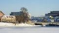 Neighborhood of old houses and modern buildings in winter. Retro versus modern style. Contrast in architecture. Royalty Free Stock Photo