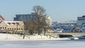 Neighborhood of old houses and modern buildings in winter. Retro versus modern style. Contrast in architecture. Royalty Free Stock Photo