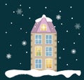 Urban beige house decorated for the New Year. Christmas trees in the windows. Snow, beautiful snowflakes in the Royalty Free Stock Photo