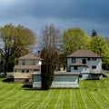 Neighborhood of typical small houses with green lawn in Port Gamble, Washington, USA Royalty Free Stock Photo