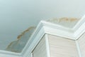 Neighbors have a water leak, water-damaged ceiling, close-up of a stain on the ceiling Royalty Free Stock Photo