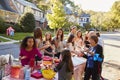 Neighbours helping themselves to food at a block party Royalty Free Stock Photo