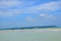 Beach landscape with clouds and reflecting water surface Royalty Free Stock Photo