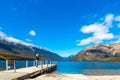 NELSON LAKES NATIONAL PARK, NEW ZEALAND - OCTOBER 16, 2018: Woman on a pier at the river Rotoiti Royalty Free Stock Photo
