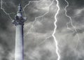 Nelson\'s Column - iconic London landmark situated in Trafalgar square with lightning