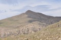 Nemrut Dagi. Mountains on the background of sky. Vertices covered with snow. Tourism