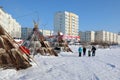Nenets dwellings near city buildings in the city of Nadym in northern Siberia