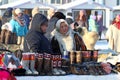 Nenets women sell warm national shoes made of reindeer fur