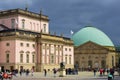 The Neo-Classical State Opera House left and St Hedwig`s Cathedral with an unusual modern dome in Berlin