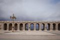 Arches at the square of Plaza de la Armeria in cloudy day. Madrid, Spain.