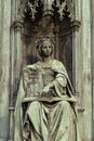 Neo-gothic statue of woman holding book