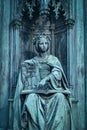 Neo-gothic statue of woman holding book