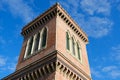 Neo-Gothic tower. Textile Museum in Busto Arsizio. Neo-Gothic construction in terracotta bricks with turrets and ogival windows Royalty Free Stock Photo