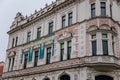 Neo-Renaissance white building of the former Farmers` bank Podripska with red sgraffito mural decorated plaster in Roudnice nad Royalty Free Stock Photo