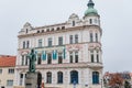 Neo-Renaissance white building of the former Farmers` bank Podripska with red sgraffito mural decorated plaster and statue of Jan Royalty Free Stock Photo