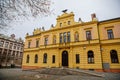 Neo-renaissance yellow historical building of Sokolovna, picturesque street, beautiful cityscape of medieval town in winter day,