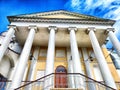 Neoclassical Architecture Under a Blue Sky. Stately building with columns and steps against a clear sky Royalty Free Stock Photo