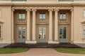 Neoclassical manor in beige. Four large columns...