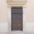 Neoclassical style house entrance dark brown door, Athens Greece.