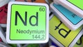 Neodymium Nd block on the pile of periodic table of the chemical elements blocks. 3D rendering