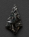 Obsidian arrowhead on white background
