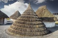 Neolithic straw cone-shaped houses on display near Stonehenge in England Royalty Free Stock Photo