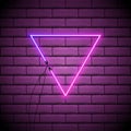 Neon abstract triangle. Glowing frame. Vintage electric symbol. Burning a pointer to a black wall in a club, bar or cafe. Design Royalty Free Stock Photo